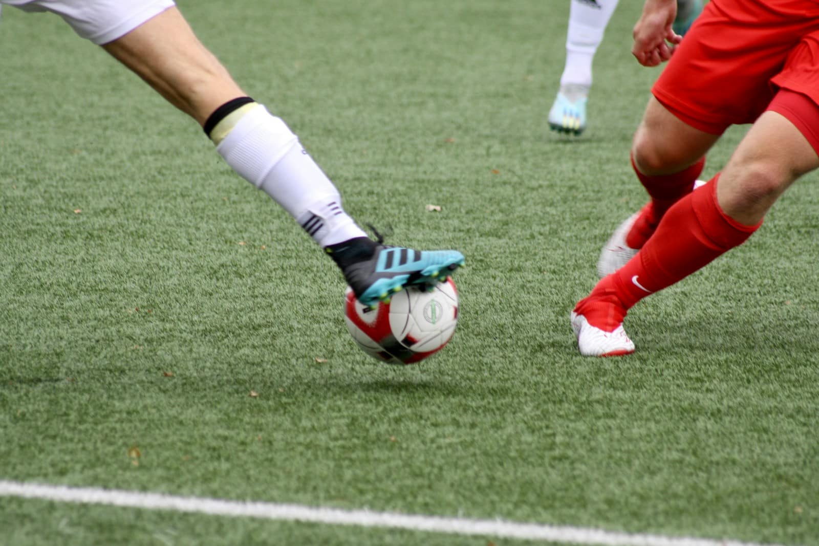 a couple of men playing a game of soccer