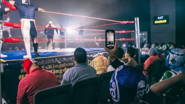 a group of people in a wrestling ring