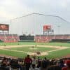 a baseball game is being played on a cloudy day