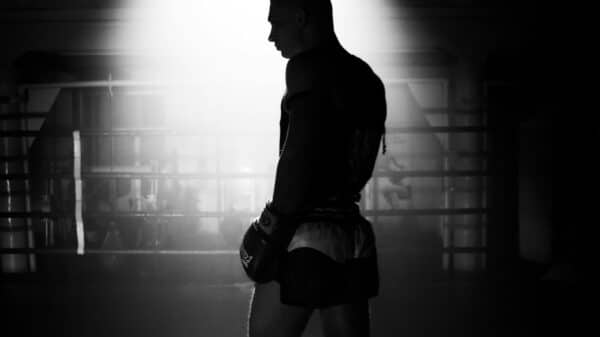 man in black leather jacket and black shorts